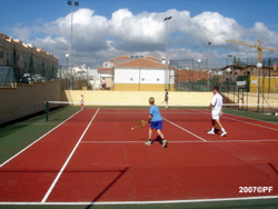 Family playing tennis